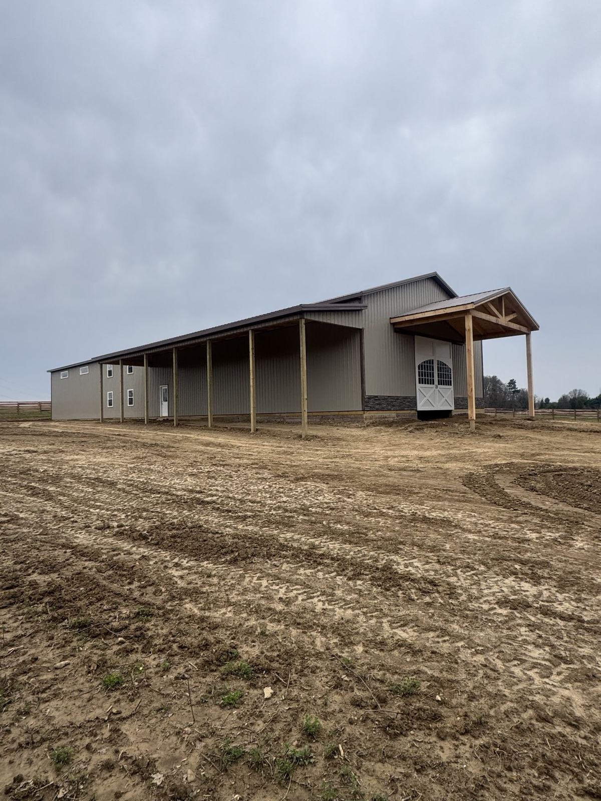 Gray barn with a long lean-to